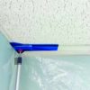 ZipWall Edge Head and non-skid Plate in-use with drop ceiling