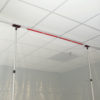 MagStrip dust barrier fastener drop-ceilingApplicator on ZipWall Pole in-use commercial